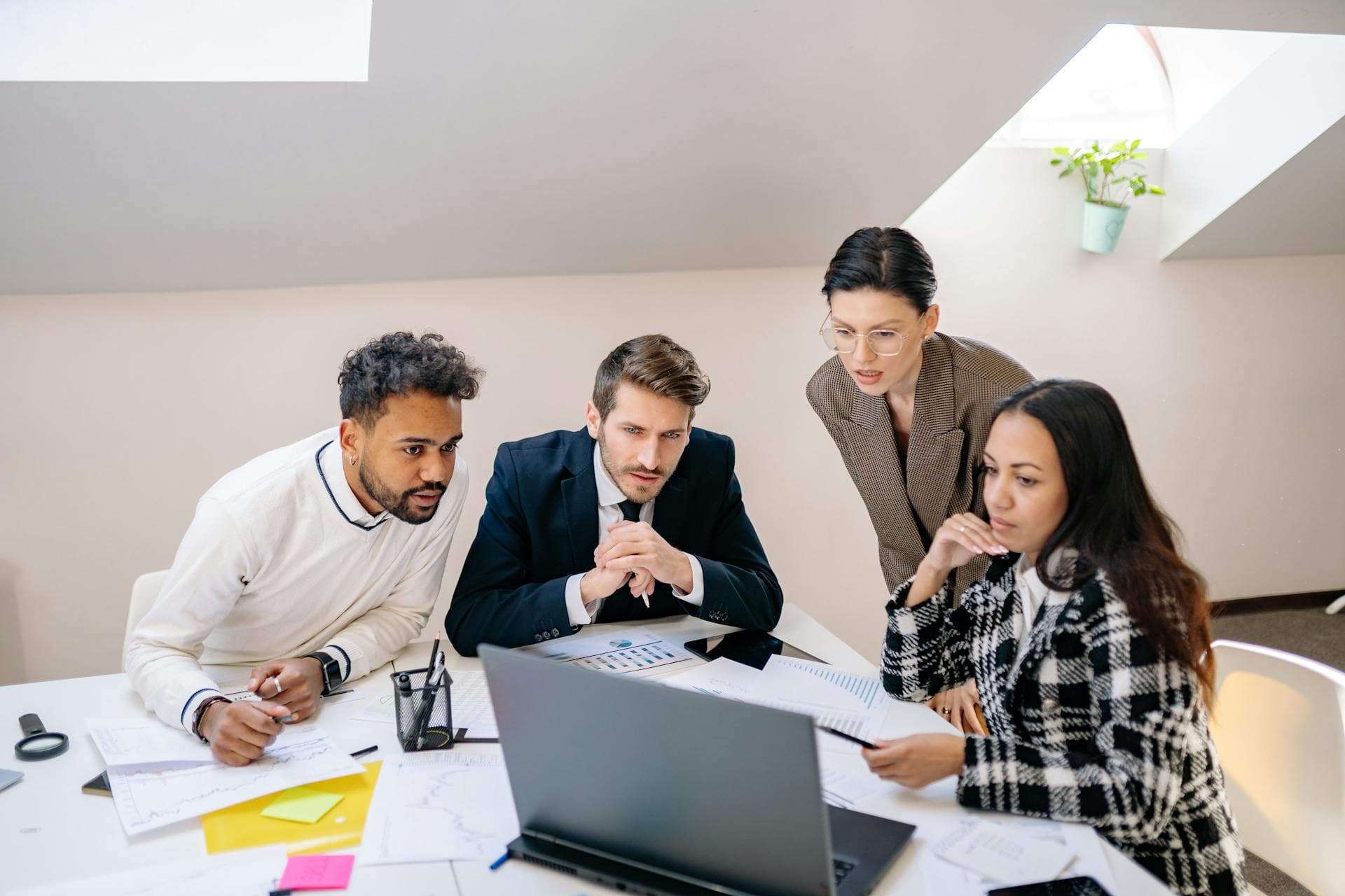 Diverse advisory team collaborating, reflecting the relationship Landmark Logix builds with institutional owners